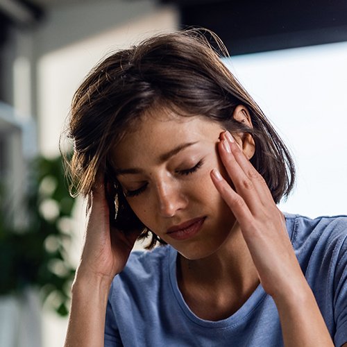 woman with migraine headache